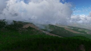 Clouds created by air cooling as it moves up the mountain in FlightGear 2020.3. In Corsica. The instability of the air column was rather high for this demonstration.